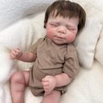 18-inch reborn vinyl baby boy doll Ethan with soft body, hand-painted details, and lifelike newborn expression.