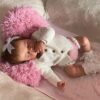 20-inch full silicone reborn baby girl doll Lily with soft skin, grafted hair, and realistic newborn features.