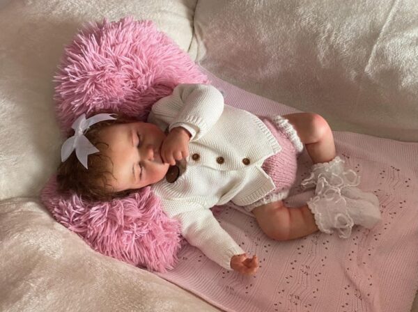 20-inch full silicone reborn baby girl doll Lily with soft skin, grafted hair, and realistic newborn features.