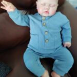 24-inch lifelike reborn baby doll Pickle with flexible limbs, realistic facial features, and soft touch body.