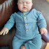 24-inch lifelike reborn baby doll Pickle with flexible limbs, realistic facial features, and soft touch body.