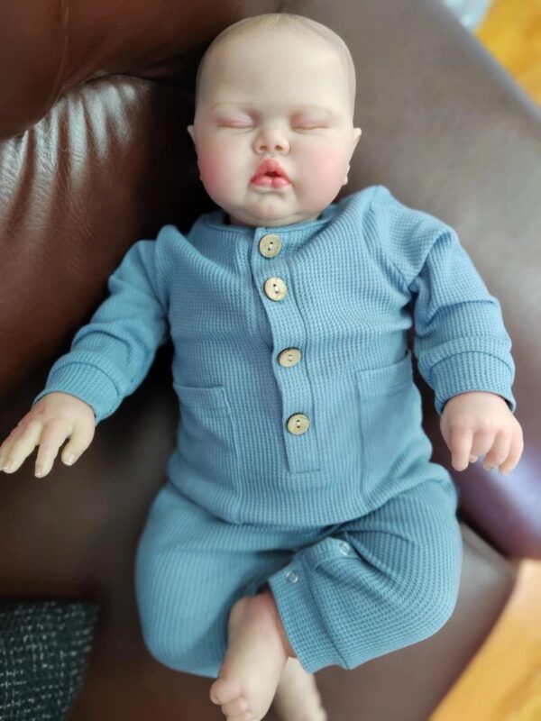 24-inch lifelike reborn baby doll Pickle with flexible limbs, realistic facial features, and soft touch body.