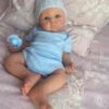 Full body silicone baby boy doll Benjamin with soft lifelike skin, realistic facial features, and flexible newborn body.