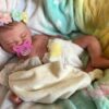 Full silicone reborn doll Charlotte posed peacefully