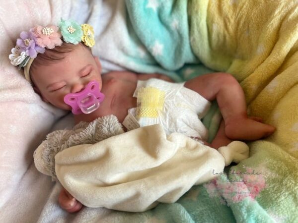 Full silicone reborn doll Charlotte posed peacefully