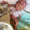 realistic silicone baby dolls Realistic full silicone reborn baby girl doll Isabella with soft skin, hand-painted details, and lifelike newborn expression.
