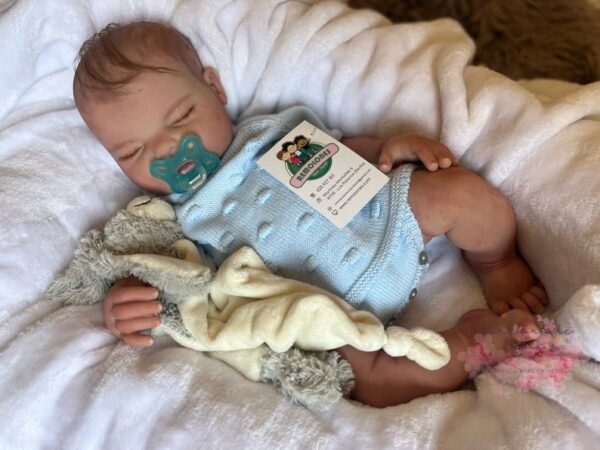 Realistic full silicone reborn baby girl doll Olivia with soft skin, hand-painted details, and lifelike facial expression. Silicone baby dolls