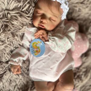 Full silicone reborn baby girl doll Penelope in a sleeping pose