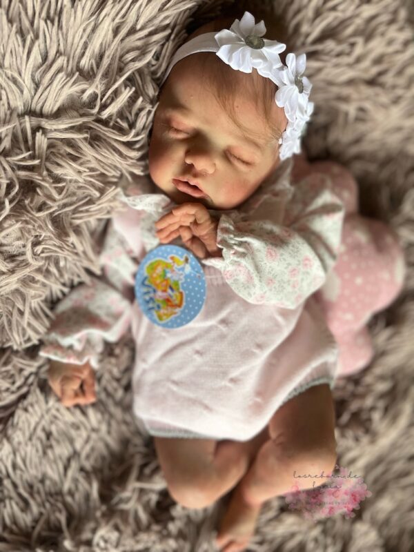 Full silicone reborn baby girl doll Penelope in a sleeping pose
