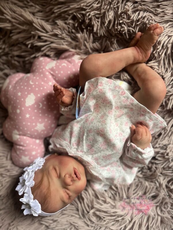 Full silicone reborn baby girl doll Penelope in a sleeping pose
