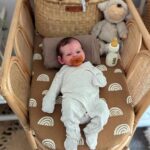 Close-up of hyper-realistic silicone baby boy Ismael showing detailed skin texture and hand-rooted lashes.