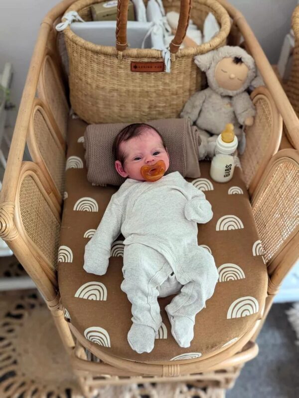 Close-up of hyper-realistic silicone baby boy Ismael showing detailed skin texture and hand-rooted lashes.