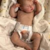 Realistic newborn silicone baby doll Asher posed sitting up, showing his flexible full limbs.