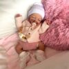 Silicone baby doll Zoey with realistic newborn features, soft touch skin, and lifelike baby girl expression.