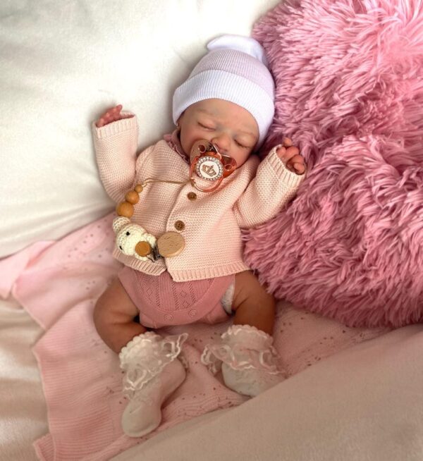 Silicone baby doll Zoey with realistic newborn features, soft touch skin, and lifelike baby girl expression.